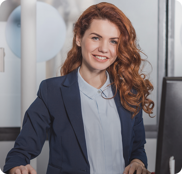 young smiling manageress using comp